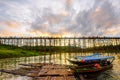 A boat dock for a river tour, built in a bamboo raft near an ancient wooden bridge in Sangkhlaburi District Royalty Free Stock Photo