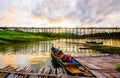 A boat dock for a river tour, built in a bamboo raft near an ancient wooden bridge in Sangkhlaburi District Royalty Free Stock Photo