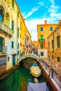 Boat docked along water canal in venice italy at dawn