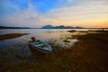 The boat docked on the lake side during beautiful golden sunset at Kwong Lake Rantau panjang Kelantan.