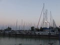 A boat is docked next to a body of water Royalty Free Stock Photo