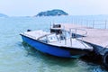 Boat docked at the seaside pier Royalty Free Stock Photo