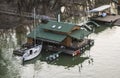 Boat docked to wooden house on danube Royalty Free Stock Photo