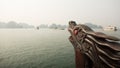 A boat with a dragon`s head floating in the ocean. Vietnam. Ha Long Bay. Royalty Free Stock Photo