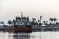 Boat dredger creating land coastline Souly Bay Salalah Oman 4