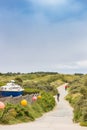 Boat in the dunes at a bicycle path in Borkum Royalty Free Stock Photo