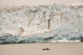 Boat dwarfed by Child's Glacier