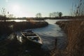 A boat at the edge of a frozen lake Royalty Free Stock Photo