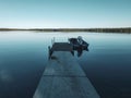 Boat at the end of the dock at sunrise, Child`s Lake, Duck Mountain Provincial Park, Manitoba, Canada Royalty Free Stock Photo