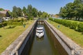 Boat entering gateway sluice on the Augustow Canal, Poland Royalty Free Stock Photo