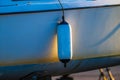 boat fender hanging against hull at sunset.. Royalty Free Stock Photo