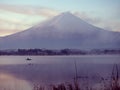 Boat with fisherman floating on lake kawaguchi on morning time w