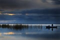 Fishing boat crossing the lake Royalty Free Stock Photo