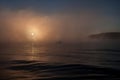 Boat with fishermen at lake in fog. Fishing background Royalty Free Stock Photo