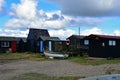 Boat and Fishermens Huts in Southwold Harbour, Suffolk, UK