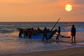 Boat with fishers on sunset background Royalty Free Stock Photo
