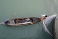 Hatibandha, Babgladesh-November 9th 2022-Three man fishing in the river with net and wooden boat, Hatibandha. Royalty Free Stock Photo