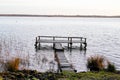 Boat fishing wooden pontoon on Lake sunrise winter day in Lacanau in Gironde Royalty Free Stock Photo