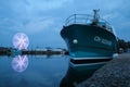 The boat floating in the harbor in Honfleur