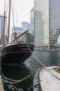 Boat in water with modern buildings in Canary Wharf Royalty Free Stock Photo