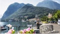 A boat and flowers on the beach. Lake Como, Italy