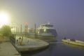 A boat in the fog at the evening Royalty Free Stock Photo