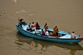 Boat full of people on Ganges river