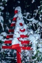 boat garden decoration covered in snow in a garden Royalty Free Stock Photo