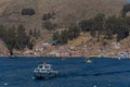 A boat goes across the Titicaca Lake in Tiquina, Bolivia