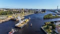 the boat is going under the bridge over the water, Royalty Free Stock Photo