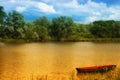 Boat on a golden pond Royalty Free Stock Photo