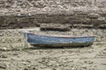 Boat on ground during tide Royalty Free Stock Photo