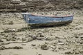 Boat on ground during tide Royalty Free Stock Photo