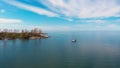 Boat halts small island, North American Lake Ontario, solitude. Serene solitude evident boat anchors near untouched