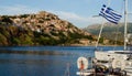 Boat in the harbor with castle on the hill at Molyvos Greece Royalty Free Stock Photo