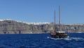 Boat heading towards the town of Fira in Santorini Royalty Free Stock Photo