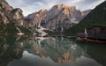 Boat house with boats at Lake Prags during sunset in the Dolomite Alps, South Tyrol Italy Royalty Free Stock Photo