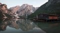 Boat house with boats at Lake Prags during sunset in the Dolomite Alps, South Tyrol Italy Royalty Free Stock Photo