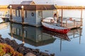 Boat house dock on calm ocean water