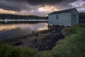 Boat house and grass at sunrise in Wagstaffe on NSW Central Coat with water Royalty Free Stock Photo