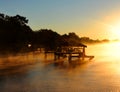 Boat House surrounded by Golden Fog