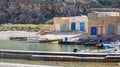 Boat houses on the Mediterranean island of Gozo Royalty Free Stock Photo