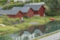 Boat houses on a stream Olden Norway. Royalty Free Stock Photo