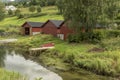 Boat houses on a stream Olden Norway. Royalty Free Stock Photo