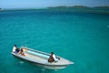 Boat hover on turquoise blue ocean Royalty Free Stock Photo