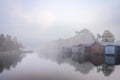 Boat huts on the lake in Plau in the Mecklenburg Lake District in Germany in the fog