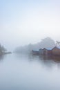 Boat huts on the lake in Plau in the Mecklenburg Lake District in Germany in the fog