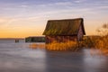 Boat huts on the lake in Plau in the Mecklenburg Lake District in Germany at sunrise