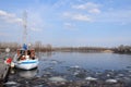 Boat on icy river (lake) Royalty Free Stock Photo