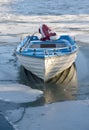 Boat in icy lake Royalty Free Stock Photo